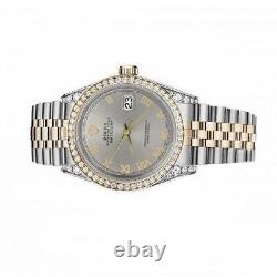 Montre Rolex Datejust avec cadran argenté à chiffres romains, boîtier de 31 mm serti de diamants et bracelet bicolore.
