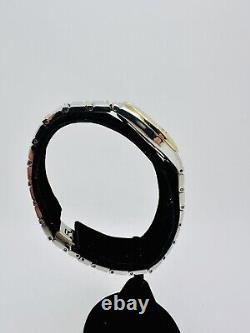 Montre pour femmes Bulova en acier inoxydable bicolore avec cadran blanc et date, d'occasion