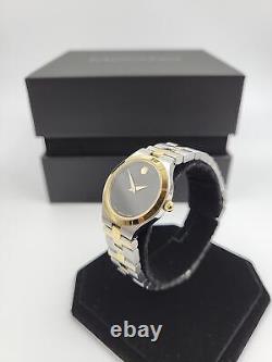 Montre suisse Movado Juro pour femmes avec cadran noir et bracelet bicolore - 0607445 (prix de vente conseillé de 1095 $)