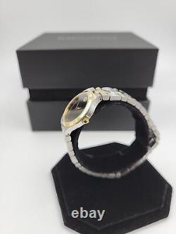 Montre suisse Movado Juro pour femmes avec cadran noir et bracelet bicolore - 0607445 (prix de vente conseillé de 1095 $)